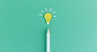 Image of pencil with light bulb above